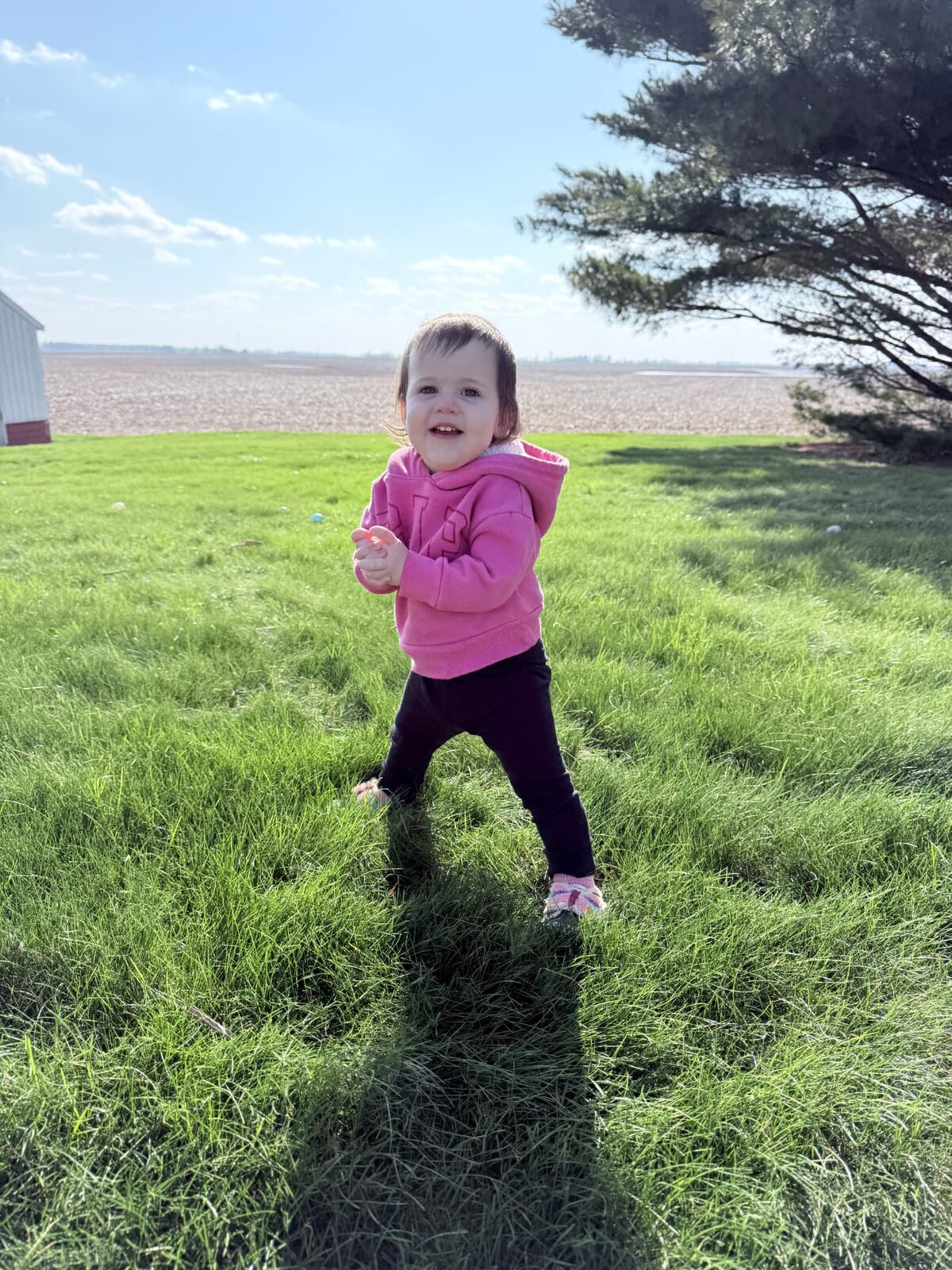 One of the Kassab daughters playing in the yard